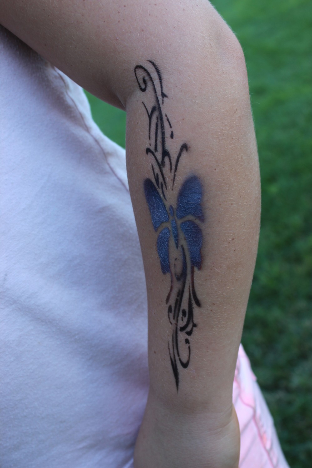 Close up of butterfly airbrush tattoo done at Canton Parks on 6/26/22.