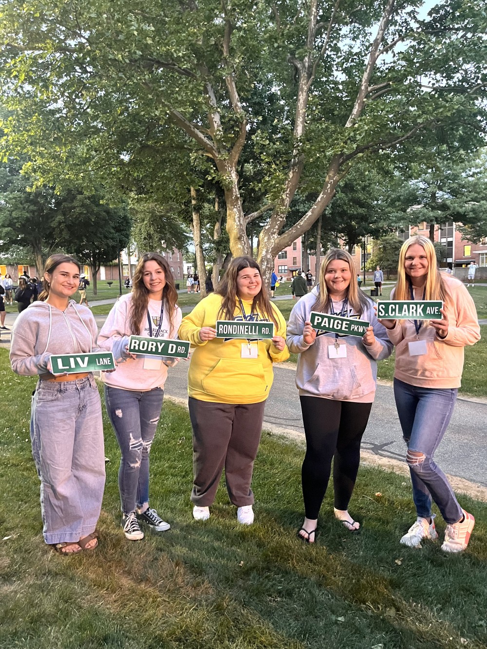 New friends at Merrimack College posing with their street signs on 6/20/22!